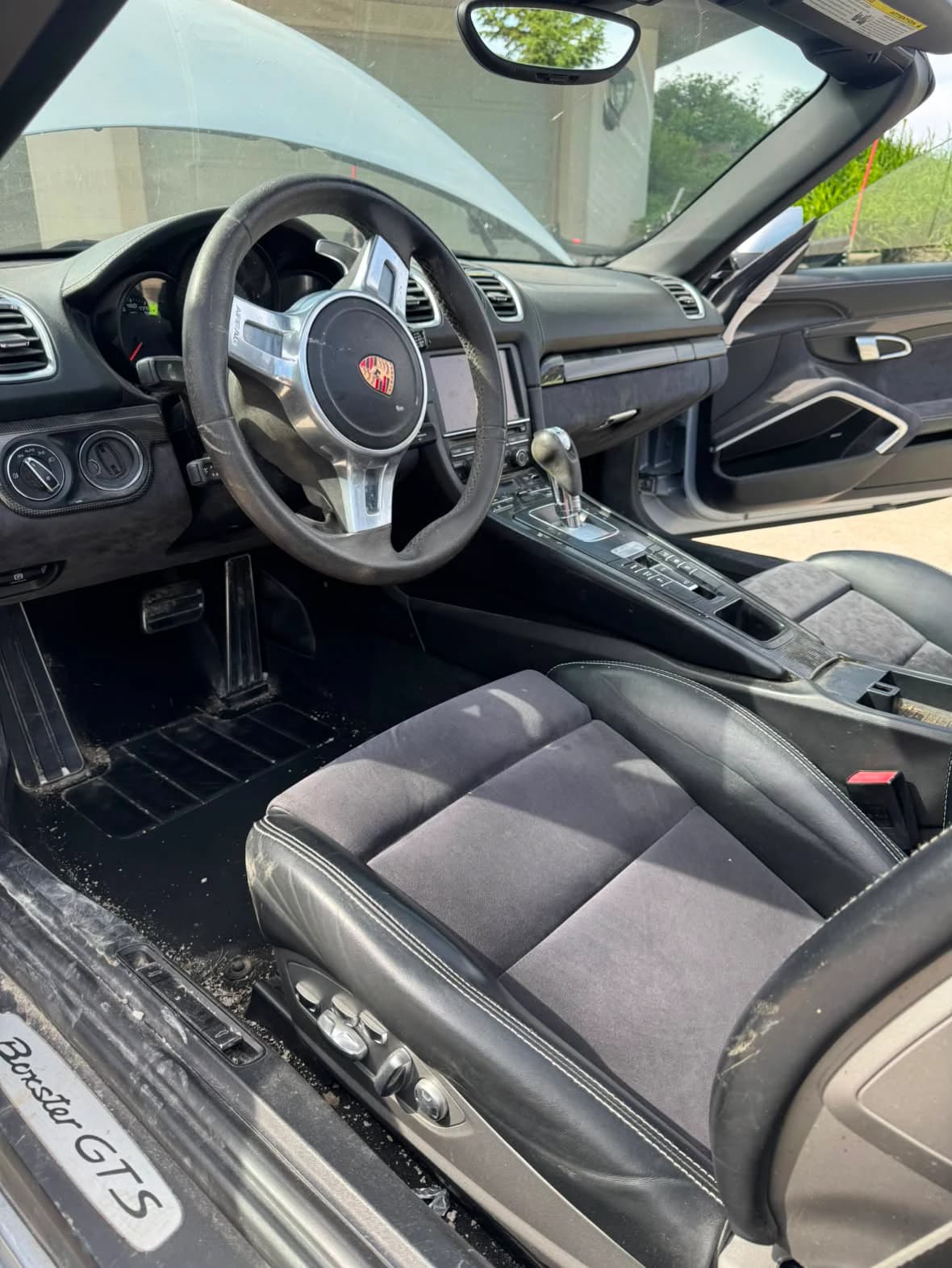 Interior of a 2015 Porsche Boxster GTS before detailing